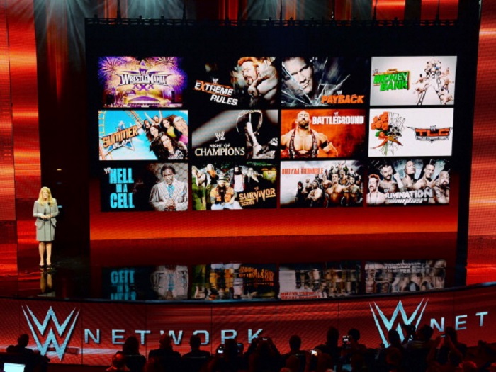 LAS VEGAS, NV - JANUARY 08: WWE Chief Revenue and Marketing Officer Michelle Wilson speaks at a news conference announcing the WWE Network at the 2014 International CES at the Encore Theater at Wynn Las Vegas on January 8, 2014 in Las Vegas, Nevada. The network will launch on February 24, 2014 as the first-ever 24/7 streaming network, offering both scheduled programs and video on demand. The USD 9.99 per month subscription will include access to all 12 live WWE pay-per-view events (pictured on screen) each year. CES, the world's largest annual consumer technology trade show, runs through January 10 and is expected to feature 3,200 exhibitors showing off their latest products and services to about 150,000 attendees. (Photo by Ethan Miller/Getty Images)