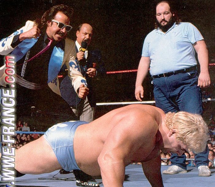 Earthquake comes out of the crowd to help Dino Bravo