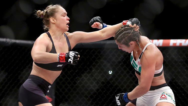Ronda Rousey defends title, thanks WWE legend