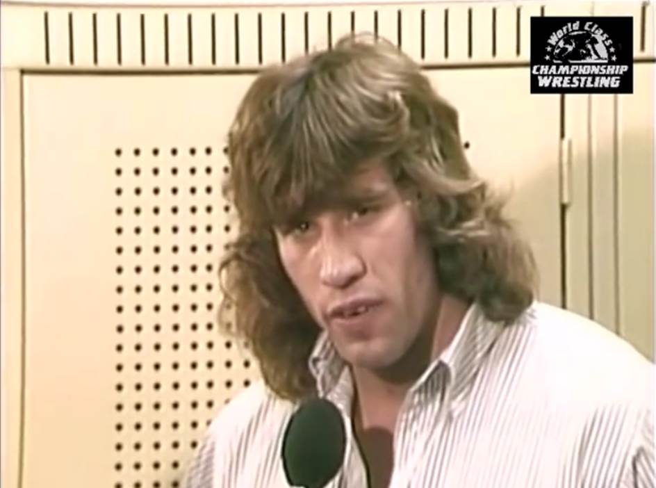 Kerry Von Erich vs. Ric Flair inside a steel cage!